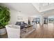 Bright living room with water views, comfortable seating, and hardwood floors at 1849 Jamaica Way, Punta Gorda, FL 33950
