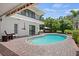 Inviting pool area with brick pavers, spa, and patio furniture at 1849 Jamaica Way, Punta Gorda, FL 33950