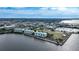 Wide aerial view of waterfront condo building and surrounding area at 200 Harbor Walk Dr # 144, Punta Gorda, FL 33950