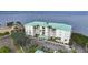 Aerial view of waterfront condo building with parking and water access at 200 Harbor Walk Dr # 144, Punta Gorda, FL 33950