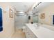 Clean bathroom with a shower and white vanity at 200 Harbor Walk Dr # 144, Punta Gorda, FL 33950