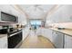 Updated kitchen with white cabinets, granite counters, and water views at 200 Harbor Walk Dr # 144, Punta Gorda, FL 33950
