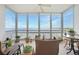 Spacious lanai with water views, wicker furniture, and potted plants at 200 Harbor Walk Dr # 144, Punta Gorda, FL 33950