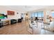 Bright living room with hardwood floors, water views, and comfy seating at 200 Harbor Walk Dr # 144, Punta Gorda, FL 33950