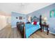 Spacious main bedroom with wood flooring and large bed at 200 Harbor Walk Dr # 144, Punta Gorda, FL 33950