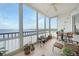 Spacious sunroom with water views and wicker furniture at 200 Harbor Walk Dr # 144, Punta Gorda, FL 33950