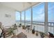 Relaxing sunroom with water views and wicker furniture at 200 Harbor Walk Dr # 144, Punta Gorda, FL 33950