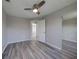 Bright bedroom featuring wood-look floors and ceiling fan at 20037 Sancraft Ave, Port Charlotte, FL 33954