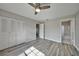 Spacious bedroom with wood-look floors and access to bathroom at 20037 Sancraft Ave, Port Charlotte, FL 33954