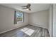Spacious bedroom with wood-look floors and window at 20037 Sancraft Ave, Port Charlotte, FL 33954