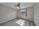 Bright bedroom with wood-look floors and ceiling fan at 20037 Sancraft Ave, Port Charlotte, FL 33954