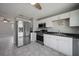 Modern kitchen with stainless steel appliances and white cabinets at 20037 Sancraft Ave, Port Charlotte, FL 33954