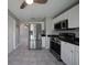 Modern kitchen with stainless steel appliances and white cabinets at 20037 Sancraft Ave, Port Charlotte, FL 33954