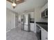 Modern kitchen with stainless steel appliances and white cabinets at 20037 Sancraft Ave, Port Charlotte, FL 33954