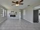 Bright living room featuring tile floors and a modern electric fireplace at 20037 Sancraft Ave, Port Charlotte, FL 33954