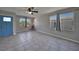 Bright living room featuring tile floors and a modern electric fireplace at 20037 Sancraft Ave, Port Charlotte, FL 33954