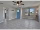 Bright living room featuring tile floors and a modern electric fireplace at 20037 Sancraft Ave, Port Charlotte, FL 33954
