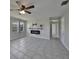 Bright living room featuring tile floors and a modern electric fireplace at 20037 Sancraft Ave, Port Charlotte, FL 33954