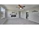 Bright living room featuring tile floors and a modern electric fireplace at 20037 Sancraft Ave, Port Charlotte, FL 33954