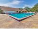 Community swimming pool with surrounding patio at 20037 Sancraft Ave, Port Charlotte, FL 33954