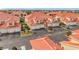 Aerial view of townhouses, street, and landscaping at 240 W End Dr # 1011, Punta Gorda, FL 33950