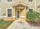 Tan exterior with a white door and walkway at 240 W End Dr # 1011, Punta Gorda, FL 33950