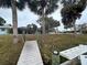Elevated wooden walkway to backyard at 2474 Como St, Port Charlotte, FL 33948