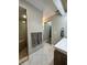 Spa-like bathroom featuring a double vanity and large shower at 2474 Como St, Port Charlotte, FL 33948