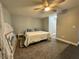 Bright bedroom with a king-size bed and ceiling fan at 2474 Como St, Port Charlotte, FL 33948