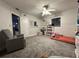 Cozy bedroom with bookcase and comfortable seating at 2474 Como St, Port Charlotte, FL 33948