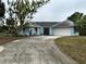 Single-story home with a two-car garage at 2474 Como St, Port Charlotte, FL 33948