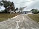 Single story home with a long driveway at 2474 Como St, Port Charlotte, FL 33948