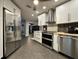 Modern kitchen with white shaker cabinets and stainless steel appliances at 2474 Como St, Port Charlotte, FL 33948