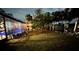 Backyard pool and patio at night at 2474 Como St, Port Charlotte, FL 33948