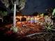 Lighted pergola and pool area at night at 2474 Como St, Port Charlotte, FL 33948