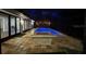 Enclosed pool area with fire pit and patio at 2474 Como St, Port Charlotte, FL 33948