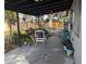 Covered back patio with space for seating and potted plants at 2488 Warne St, Port Charlotte, FL 33952