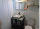 Clean bathroom with white tile and a modern vanity at 2488 Warne St, Port Charlotte, FL 33952