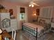 Bedroom with a metal bed frame and floral bedding at 2488 Warne St, Port Charlotte, FL 33952