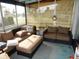 Relaxing screened porch with seating area, perfect for enjoying the outdoors at 2488 Warne St, Port Charlotte, FL 33952