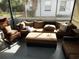 Relaxing screened porch with wicker furniture and seating at 2488 Warne St, Port Charlotte, FL 33952