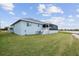 House exterior with a screened-in porch at 27 Meadowlark Ln, Placida, FL 33946
