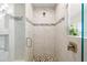 Clean bathroom with a walk-in shower and mosaic tile at 27 Meadowlark Ln, Placida, FL 33946