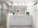 Modern bathroom with double sinks and a glass shower at 27 Meadowlark Ln, Placida, FL 33946