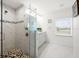 Elegant bathroom featuring a walk-in shower and double vanity at 27 Meadowlark Ln, Placida, FL 33946