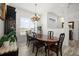 Elegant dining room featuring a large wood table and chandelier at 27 Meadowlark Ln, Placida, FL 33946