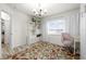 Bright home office features built-in shelving, window seating, and a decorative rug at 27 Meadowlark Ln, Placida, FL 33946