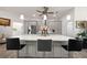 Kitchen island with seating for four and a quartz countertop at 27 Meadowlark Ln, Placida, FL 33946
