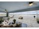 Spacious covered lanai overlooking a lake, outdoor furniture at 27 Meadowlark Ln, Placida, FL 33946
