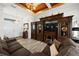 Living room with hardwood floors, large entertainment center, and fireplace at 27 Meadowlark Ln, Placida, FL 33946